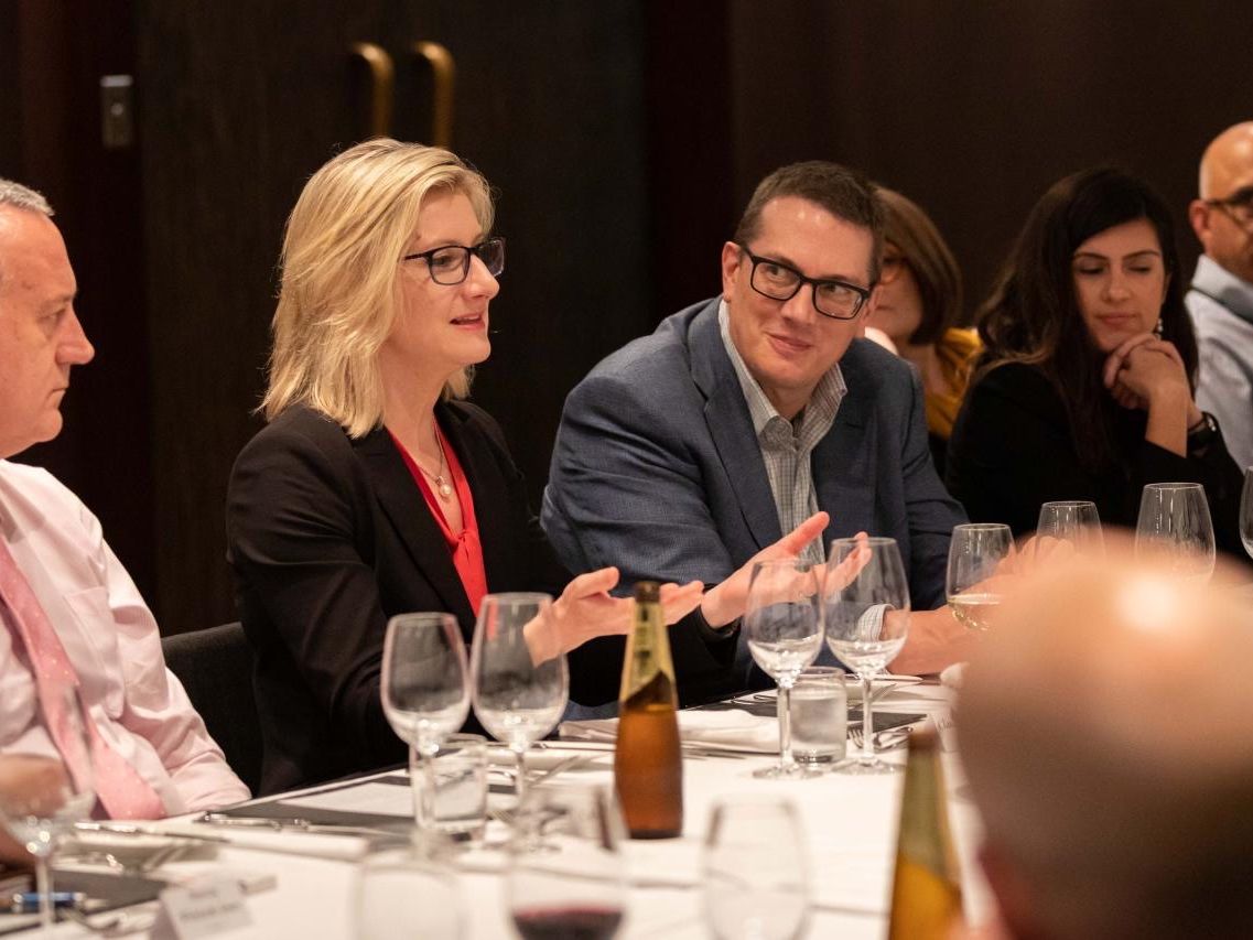Claudine Ogilvie leading an executive roundtable dinner
